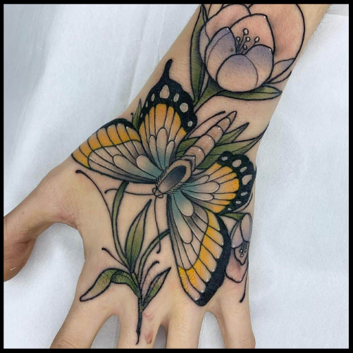 Centered Butterfly Hand Tattoo