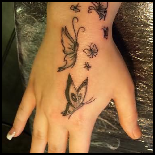 Flying Butterflies Hand Tattoo