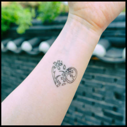 Small Heart Arm Tattoo