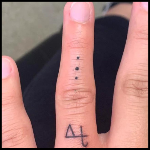 Beyoncé's Simple Dots Finger Tattoo