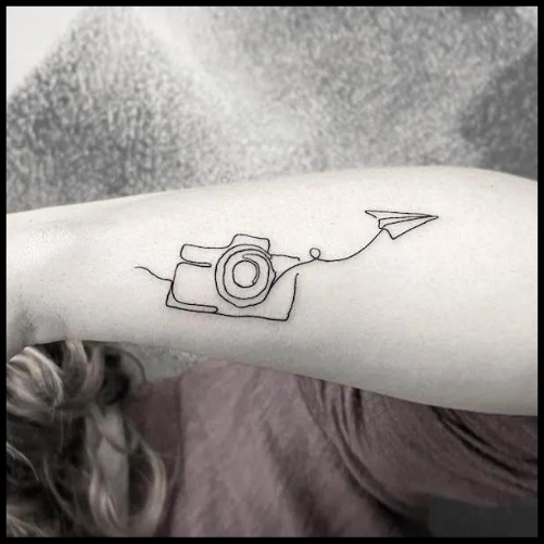 Camera and Airplane Outline Tattoo