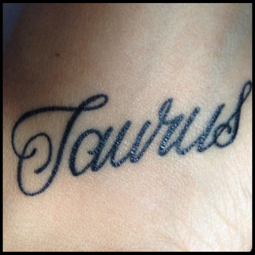 Cursive Taurus Tattoo