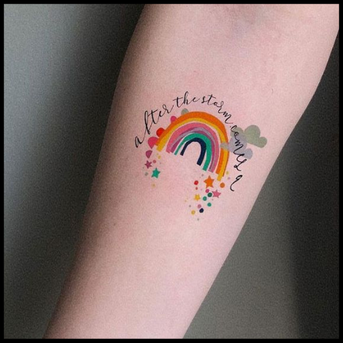 Playful & Colorful Rainbow Tattoo