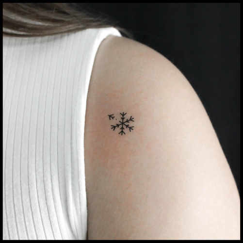 Snowflake and Plane Tattoo