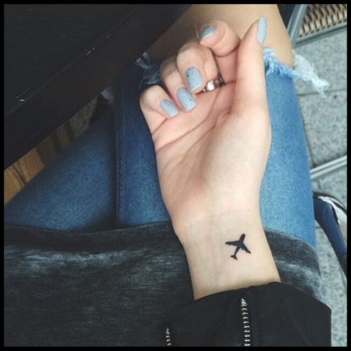 Tiny Minimalist Plane Tattoo