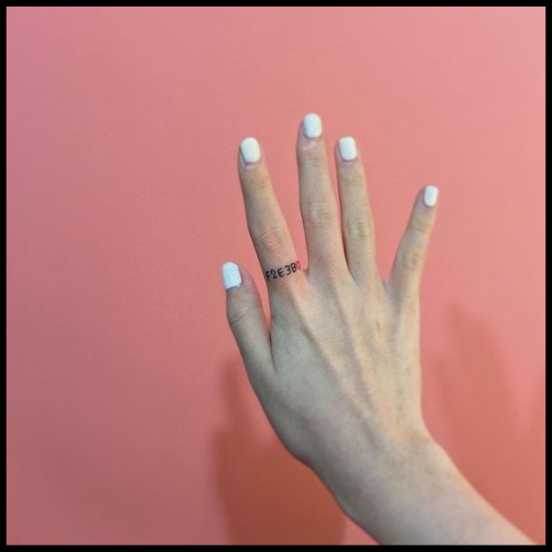 Written Ring Finger Tattoo
