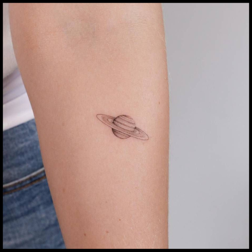 Fine Line Saturn Tattoo