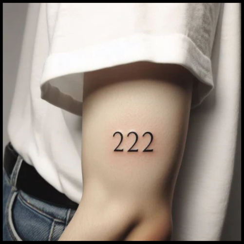 Glistening 222 Tattoo On Upper Elbow