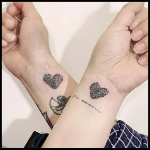 Symbolic Couple Tattoo On Hand